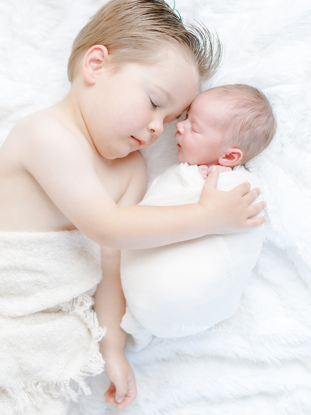 Sibling photo of big brother and baby sister at her newborn session.