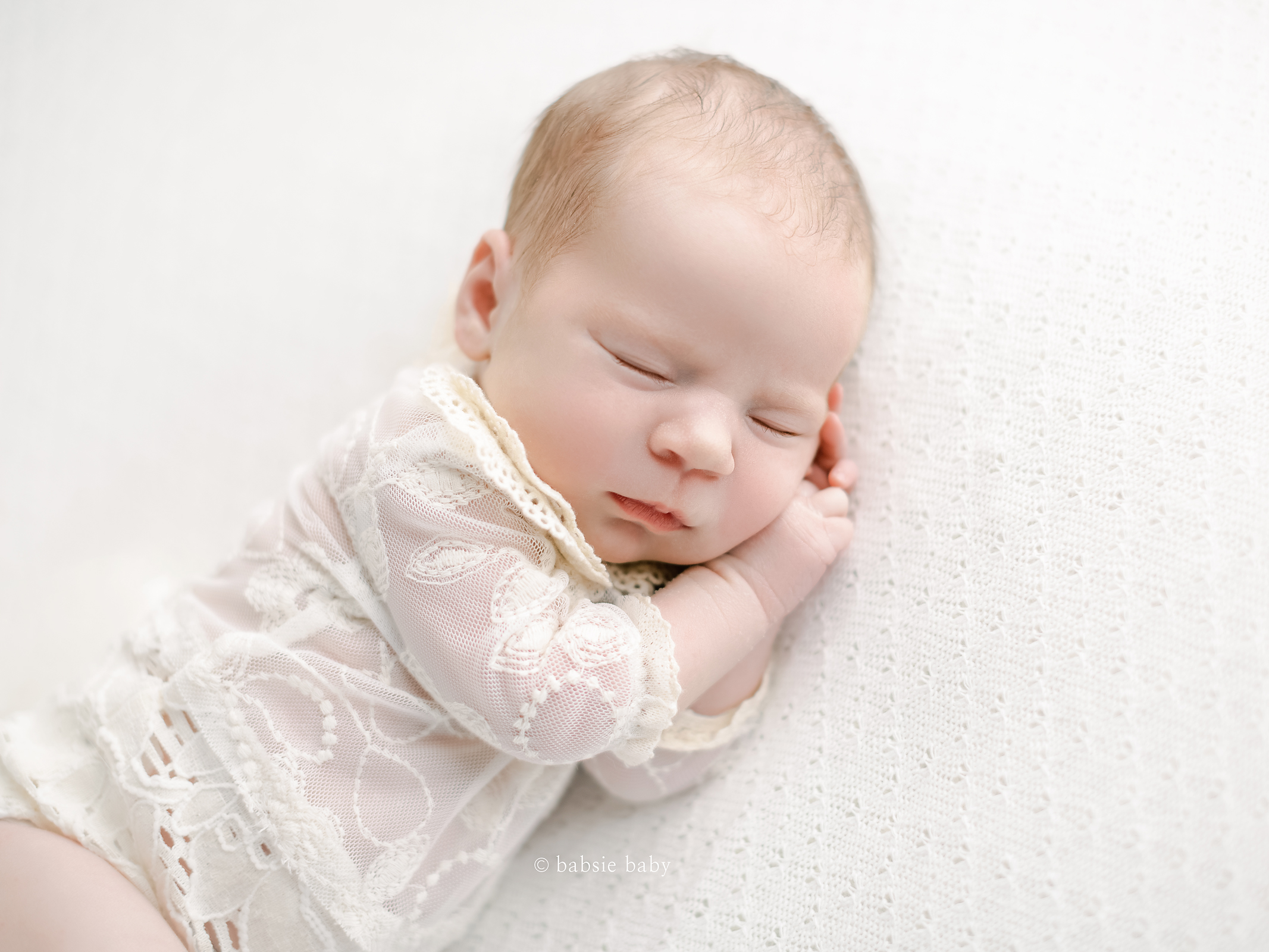 Baby girl sleeping at her newborn session in San Diego.